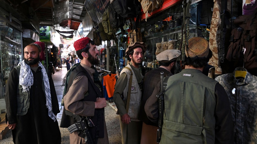 Taliban fighters shop at Bush market in Kabul on Sept. 9, 2021. (Photo via Getty Images)
