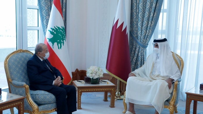Lebanese President Michel Aoun (L) meets the Emir of Qatar Sheikh Tamim bin Hamad Al Thani (R) in Doha on Nov. 29, 2021. (Photo via Getty Images)
