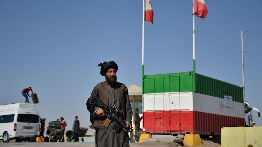 A Taliban fighter stands guard at the Islam Qala border between Iran and Afghanistan on Oct. 19, 2021. (Photo via Getty Images)