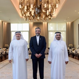 Emirati diplomatic advisor Anwar Gargash (L) poses with Iran's top nuclear negotiator Ali Baqeri-Kani (C) and the UAE's Minister of State for Foreign Affairs Khalifa Shaheen Al-Marar in Abu Dhabi on Nov. 24, 2021. (Handout photo via Twitter)
