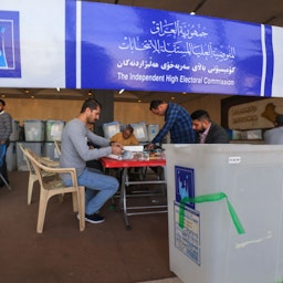 Employees of Iraq's Independent High Electoral Commission conduct a partial manual recount of votes for the Oct. 10 parliamentary elections in Baghdad, Iraq on Nov. 23, 2021. (Photo via Getty Images)