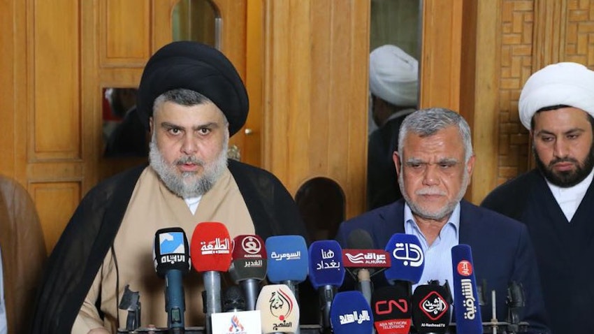 Sadrist Movement leader Muqtada Al-Sadr (L) and Fatah Alliance chief Hadi Al-Ameri (R) in Najaf, Iraq on Jun. 12, 2018. (Photo via Getty Images)