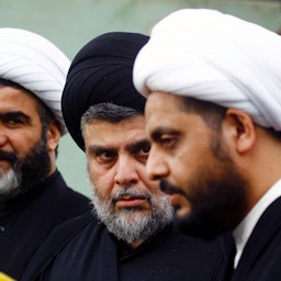 Muqtada Al-Sadr (L) and Asa’ib Ahl Al-Haq Secretary-General Qais Al-Khazali in Najaf, Iraq on Oct. 18, 2016. (Photo via Getty Images)