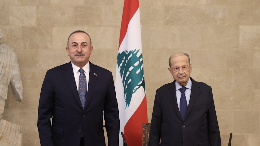 Turkish Foreign Minister Mevlüt Çavuşoğlu (L) and Lebanese President Michel Aoun (R) pose for a photo in Beirut, Lebanon on Nov. 16, 2021. (Photo via Getty Images)
