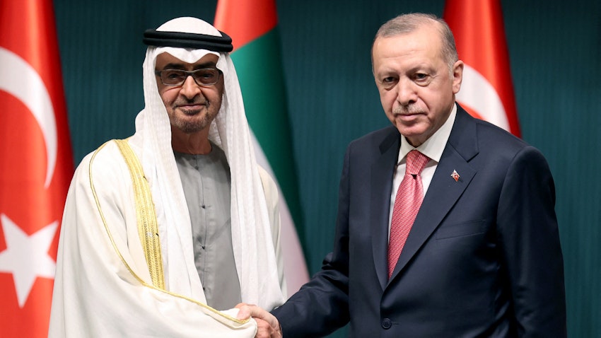 Turkish President Recep Tayyip Erdogan (R) shakes hands with Abu Dhabi's Crown Prince Sheikh Mohammed bin Zayed Al Nahyan in Ankara, on Nov. 24, 2021. (Photo via Getty Images)