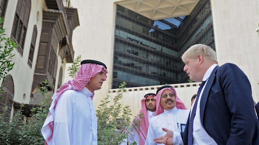 Then Saudi foreign minister Adel Al-Jubeir (L) and his British counterpart and now Prime Minister Boris Johnson (R) in Jeddah on Jan. 25, 2018. (Photo via Getty Images)