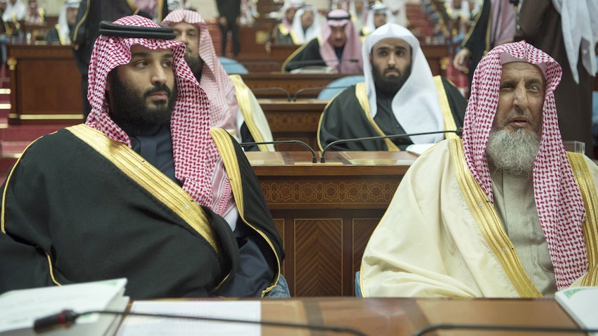 Saudi Grand Mufti Sheikh Abdulaziz bin Abdullah bin Mohammed Al Al-Sheikh (R) sits with Crown Prince Mohammed bin Salman Al Saud (L) during the seventh session of the Shura Council in Riyadh on Dec. 13, 2017. (Photo via Getty Images)