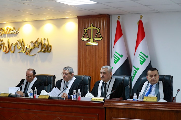 Iraqi judges attend a court session at the Supreme Judicial Council in Baghdad, Iraq on Dec. 27, 2021. (Photo via Getty Images)