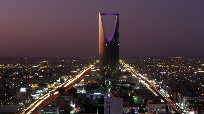 Kingdom Center, the tallest skyscraper in Saudi Arabia, dominates the evening cityscape of Riyadh on Jan. 1, 2003. (Photo via Getty Images)