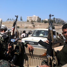 Houthi fighters ride a vehicle in Sana’a Governorate, Yemen on Nov. 16, 2017. (Photo via Getty Images)