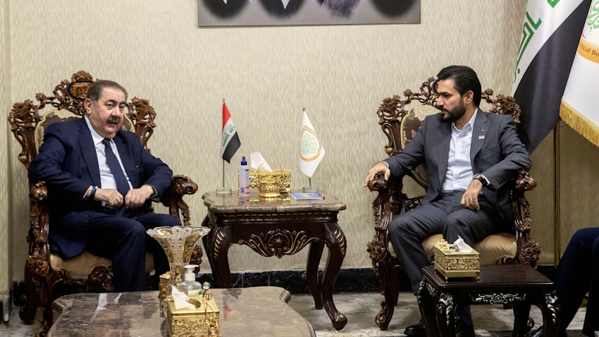 Iraq's Sadrist bloc MP Hassan Al-Adari (R) meets with senior KDP official Hoshyar Zebari (L) to discuss the formation of the new government in the capital Baghdad, on Nov. 5, 2021. (Photo via Getty Images)