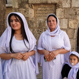 Yazidi women stand at the Temple of Lalish near the city of Dohuk, Iraq on Oct. 7, 2021. (Photo via Getty Images)