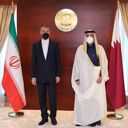Qatari Emir Sheikh Tamim bin Hamad Al Thani (R) meets Iranian Foreign Minister Hossein Amir-Abdollahian (L) in Doha on Jan. 11, 2021. (Photo by Qatari Foreign Ministry/Handout via Getty Images)