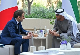 French President Emmanuel Macron and then-Crown Prince of Abu Dhabi Mohammed bin Zayed Al Nahyan in Dubai, United Arab Emirates on Dec. 3, 2021. (Photo via Getty Images)