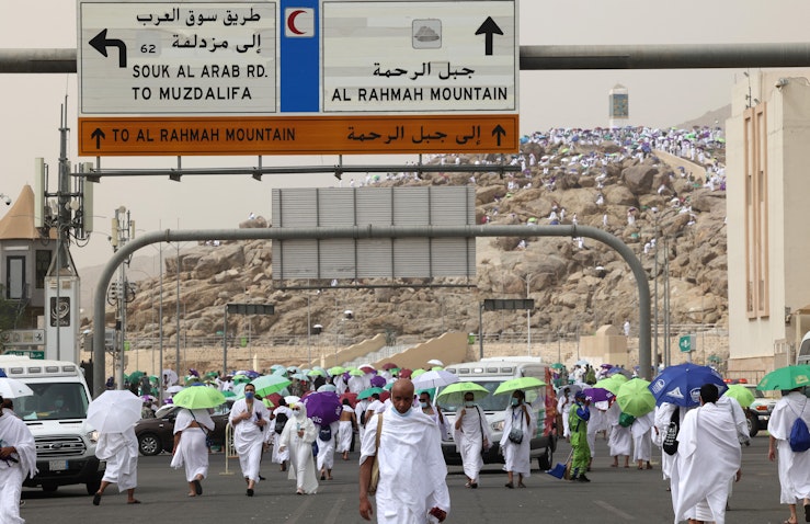 Muslim pilgrims gather around Mount Arafat during Haj near the holy city of Mecca, Saudi Arabia on July 19, 2021. (Photo via Getty Images)