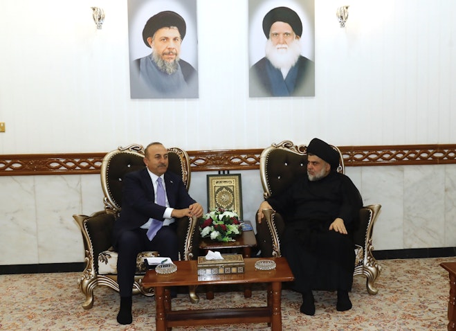 Sadrist Movement leader Muqtada Al-Sadr meets with Turkish Foreign Minister Mevlüt Çavuşoğlu in Najaf, Iraq on Oct. 11, 2018. (Photo via Getty Images)