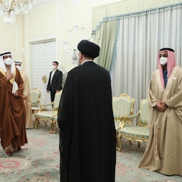 Iranian President Ebrahim Raisi welcomes an Emirati delegation in Tehran on Dec. 6, 2021. (Photo via Iranian president's website)