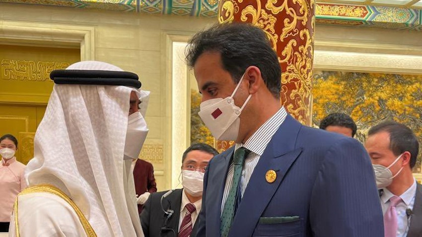 Qatar's Emir Sheikh Tamim bin Hamad Al Thani meets with Abu Dhabi's Crown Prince Mohammed bin Zayed Al Nahyan in Beijing on Feb. 5, 2022. (Handout photo via Twitter)