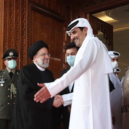 Iran's President Ebrahim Raisi is greeted by Qatar's Emir Sheikh Tamim bin Hamad Al Thani in Doha on Feb. 21, 2022. (Photo via Iranian president's website)