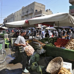 Iraqis shop at Baghdad's Sadriyah Market on Sept. 10, 2021. (Photo via Getty Images)