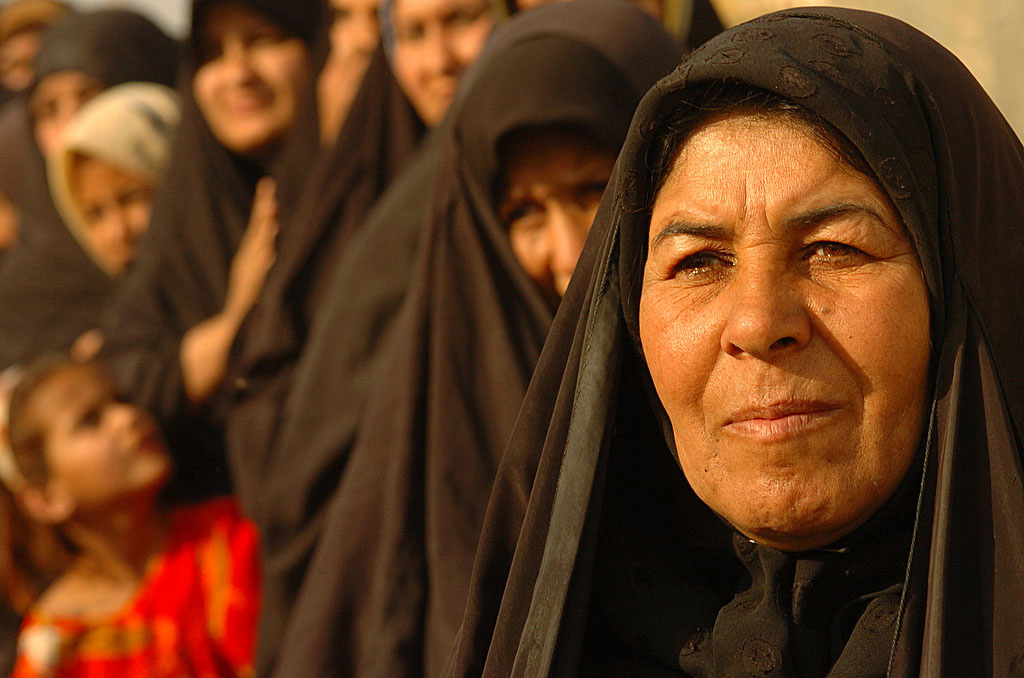 Iraqi women line up to receive humanitarian assistance in Kamaliya, Iraq on Apr. 28, 2006. (Photo via Wikimedia Commons)