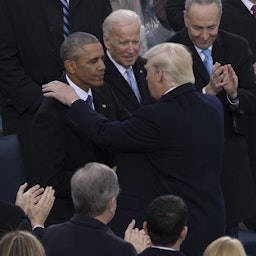 Then US President Donald Trump shakes hands with former president Barack Obama during the 58th Presidential Inauguration in Washington, D.C. on Jan. 20, 2017. (Photo by Cristian Ricardo via Wikimedia)