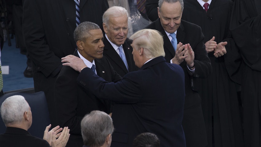 Then US President Donald Trump shakes hands with former president Barack Obama during the 58th Presidential Inauguration in Washington, D.C. on Jan. 20, 2017. (Photo by Cristian Ricardo via Wikimedia)