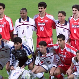 the Iranian and US teams pose together in Lyon, France before their World Cup match on June 21, 1998. (Photo via Getty Images)