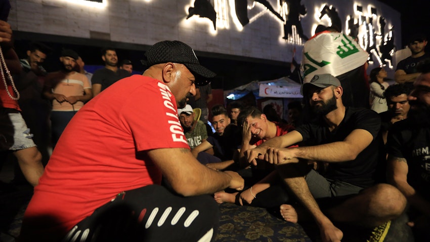 Participants play the traditional Iraqi game Mheibes, played during Ramadhan, at Tahrir Square in Baghdad, Iraq on May 1, 2020. (Photo via Getty Images)