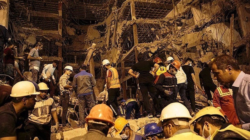 Rescuers continue to search for bodies under the rubble of the Metropol building in Abadan on May 27, 2022. (Photo via Tasnim News Agency)