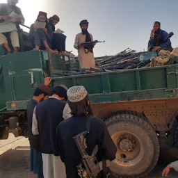 Taliban fighters receive military equipment belonging to the former Afghan government from Iran on June 8, 2022. (Source: QaharBalkhi/Twitter)