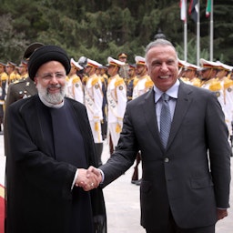 Iran's President Ebrahim Raisi welcomes Iraqi Prime Minister Mustafa Al-Kadhimi in Tehran, Iran on June 26, 2022. (Photo via Iranian Presidency)