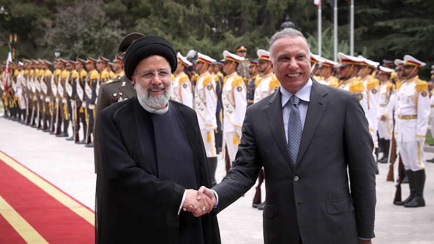 Iran's President Ebrahim Raisi welcomes Iraqi Prime Minister Mustafa Al-Kadhimi in Tehran, Iran on June 26, 2022. (Photo via Iranian Presidency)