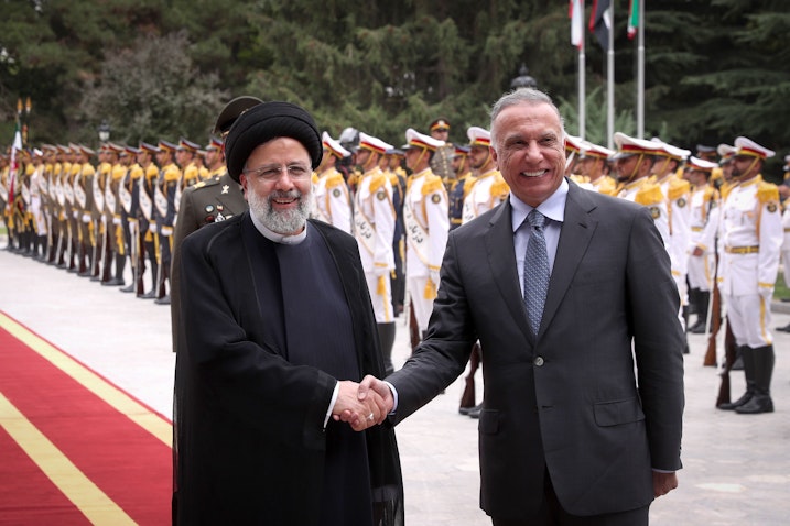 Iran's President Ebrahim Raisi welcomes Iraqi Prime Minister Mustafa Al-Kadhimi in Tehran, Iran on June 26, 2022. (Photo via Iranian Presidency)