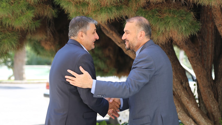 Iranian Foreign Minister Hossein Amir-Abdollahian welcomes the AEOI chief Mohammad Eslami in Tehran, Iran on June 22, 2022. (Photo via Iranian Foreign Ministry)