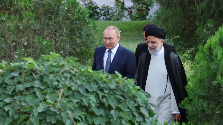 Russian President Vladimir Putin walking alongside Iranian President Ebrahim Raisi in Tehran, Iran on July 19, 2022. (Photo via Iranian presidency)