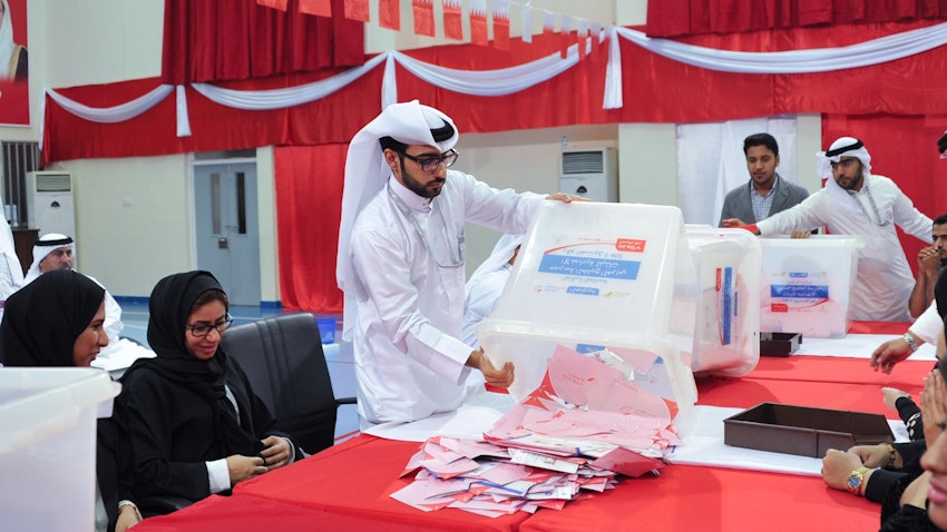 An official empties a voting box in Southern Region, Bahrain in 2018 (Photo via Legislation and Legal Opinion Commission)