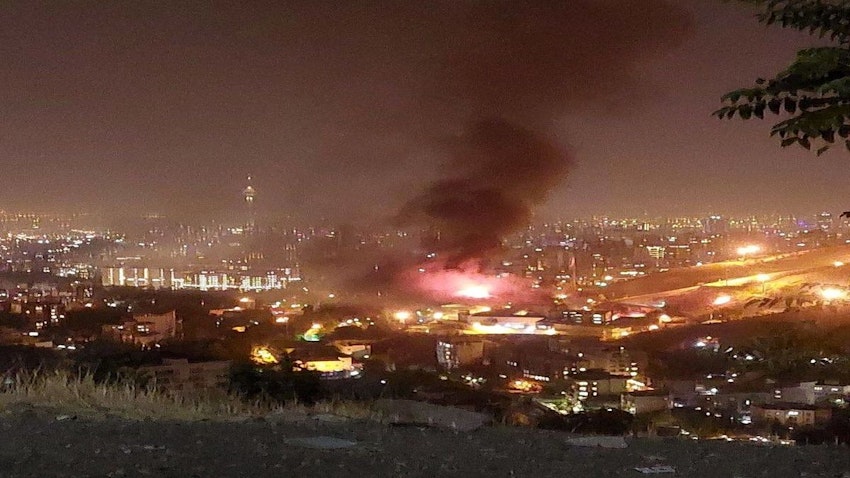 A hilltop view of Evin Prison on fire in northern Tehran, Iran on Oct. 15, 2022. (Photo via social media)
