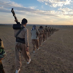 Members of the Iranian Kurdish group Sazman-e Khabat march in a field on Oct. 11, 2018. Location unknown. (Photo via WikiCommons)