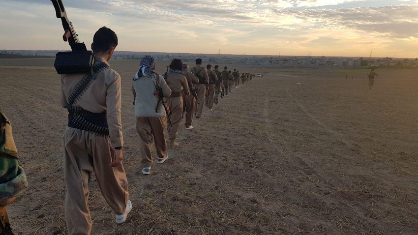 Members of the Iranian Kurdish group Sazman-e Khabat march in a field on Oct. 11, 2018. Location unknown. (Photo via WikiCommons)