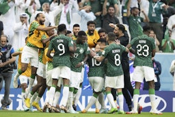 Saudi players celebrate win against Argentina in the World Cup in Lusail City, Qatar on Nov. 22, 2022. (Photo via Getty Images)