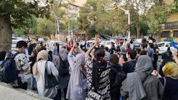 Iranians take to the streets to protest the death of Mahsa Amini in Tehran, Iran on Sept. 19, 2022. (Photo via Getty Images)