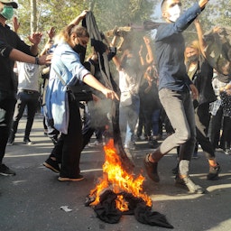 Iranians protest against compulsory hijab in Tehran, Iran on Oct. 1, 2022. (Photo via  Getty Images)