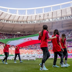 Iran's flag carried in the stadium during FIFA World Cup in Doha, Qatar on Nov. 25, 2022. (Photo via Getty Images)