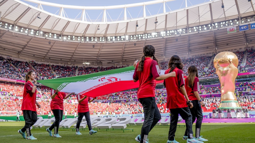 Iran's flag carried in the stadium during FIFA World Cup in Doha, Qatar on Nov. 25, 2022. (Photo via Getty Images)