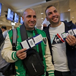 Football fans prepare to board a flight from Tel Aviv to Doha to attend the World Cup on Nov. 20, 2022. (Photo via Getty Images)