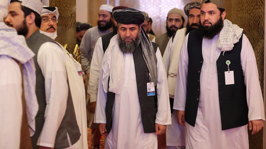 Members of the Taliban delegation arrive for peace talks with the Afghan government in Doha, Qatar on July 18, 2021. (Photo via Getty Images)