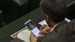 A lawmaker drafts an Instagram Story in the Iranian parliament in Tehran, Iran on May 27, 2020. (Photo via Fars News Agency)