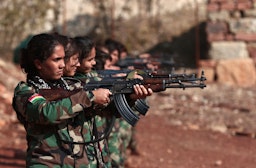 Female Kurdish Peshmerga fighters affiliated with Iran's seperatist Kurdistan Freedom Party take aim at a base in Erbil, Kurdistan Region of Iraq on Dec. 1, 2022. (Photo via Getty Images)