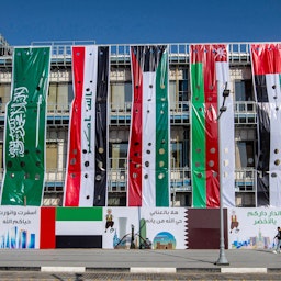 Banners of countries participating in the 25th Arabian Gulf Cup football championship are put on display in Basra, Iraq on Dec. 29, 2022. (Photo via Getty Images)